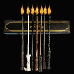 Set of decorative wands with flames against a black background