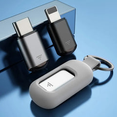 Two USB-C adapters and a gray case on a blue background