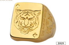Gold ring with tiger design and engraved text on a white background