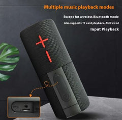 Black portable speaker with red logo on a dark background, featuring text about music playback modes.
