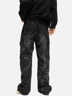 Black cargo pants with white stitching on a white background