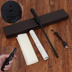 Black wand, USB cable, and cylindrical objects on a wooden surface