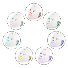 White LED face masks with colorful lighting effects on a white background