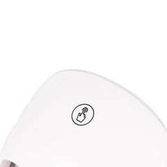 Close-up of a white electronic device with a black icon on a white background