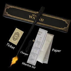 Black magic wand with accessories including a ticket, charger, and paper on a black background.