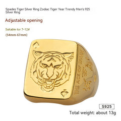 Gold ring with tiger design and text on a white background